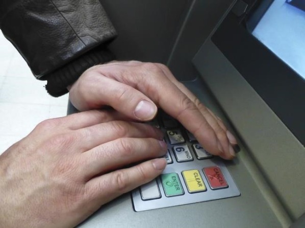 block hand while entering ATM pin